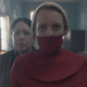 June (Elisabeth Moss) is forced to wear a gag while out in Washington D.C.